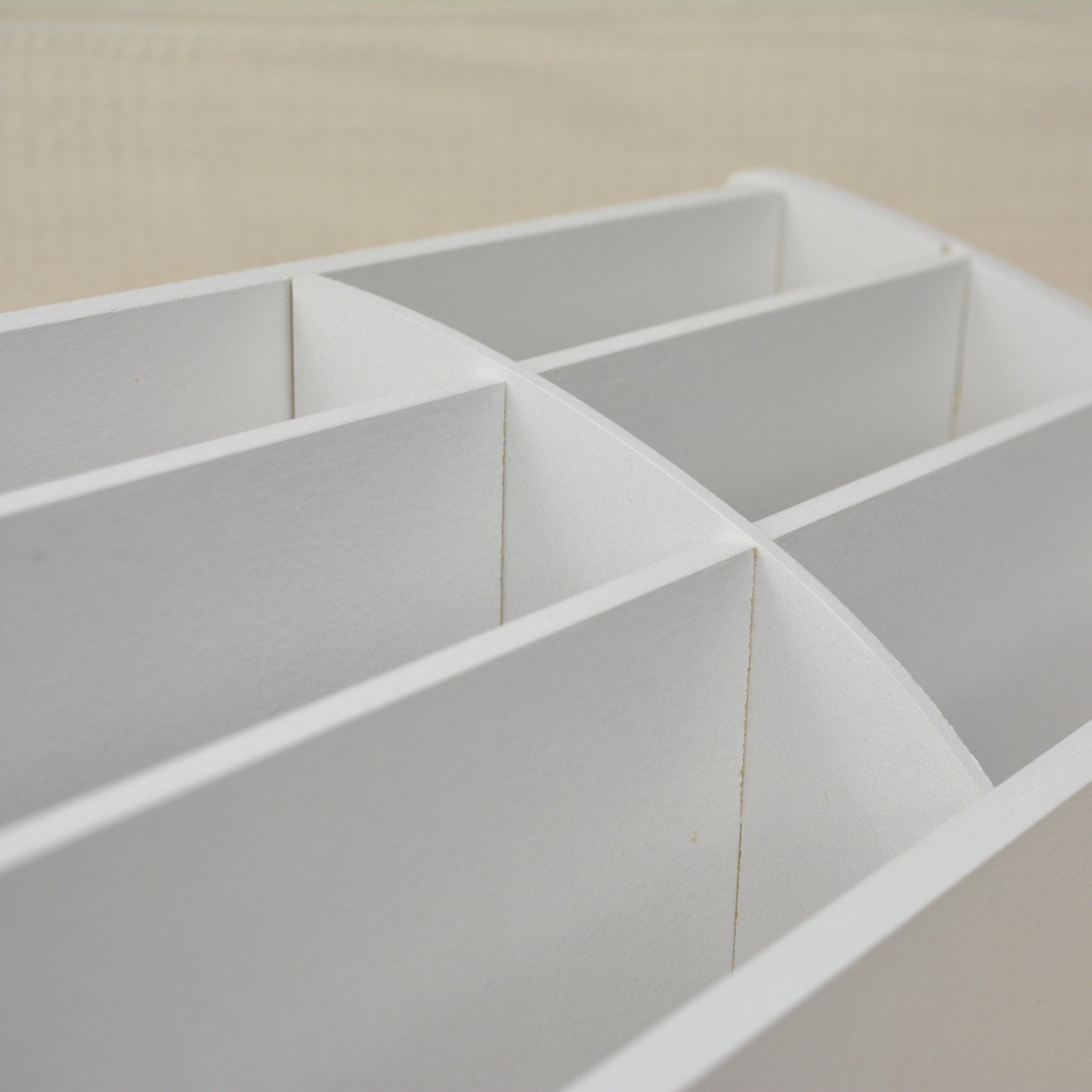 closeup view of the white dividers in an organizer made for greeting cards