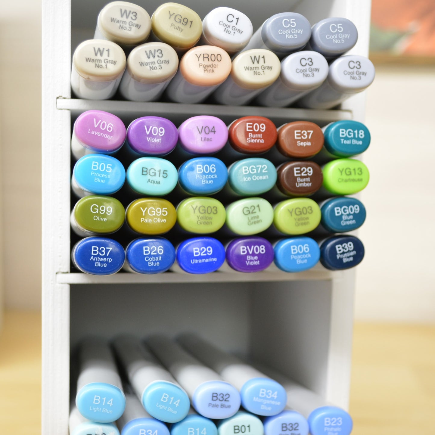 an individual marker organizer cubby holding twenty four copic markers 