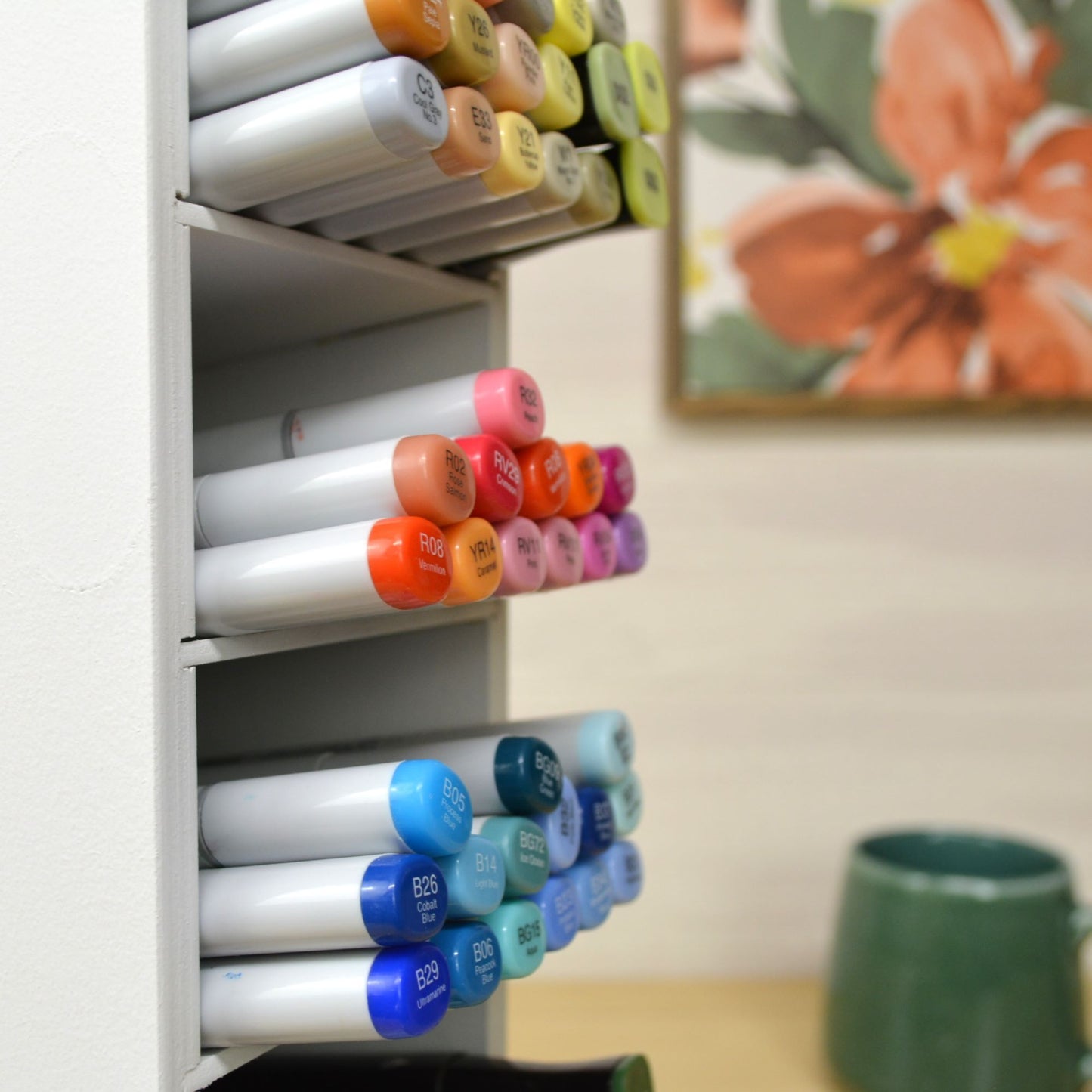 side view of marker organizer slanted shelf and how the markers stick out about one inch