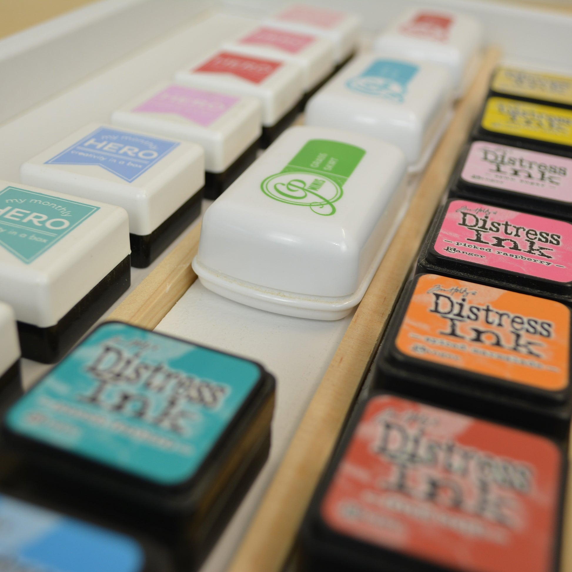 closeup of the wooden dividers separating rows of mini ink cubes in a tray