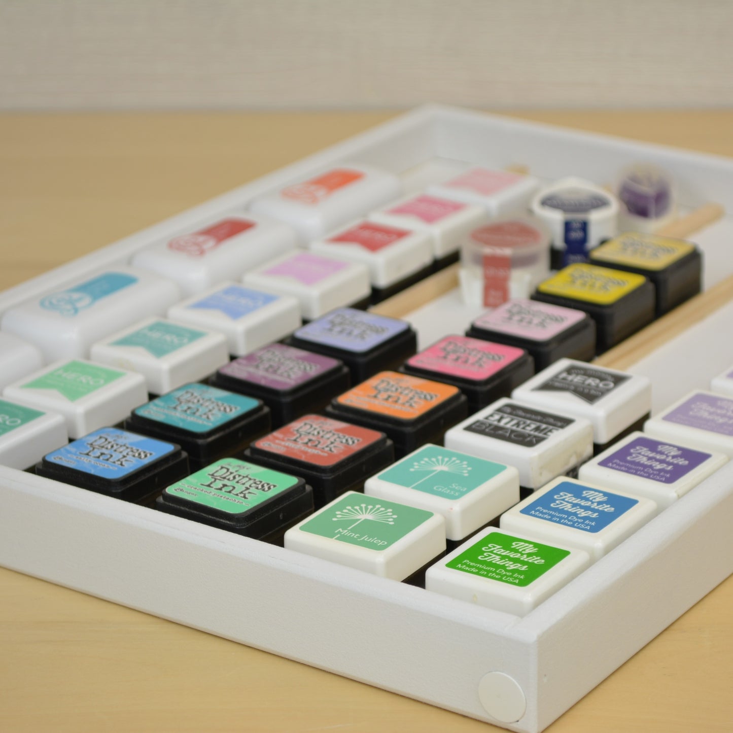 closeup view of rows of mini ink cubes in a white tray