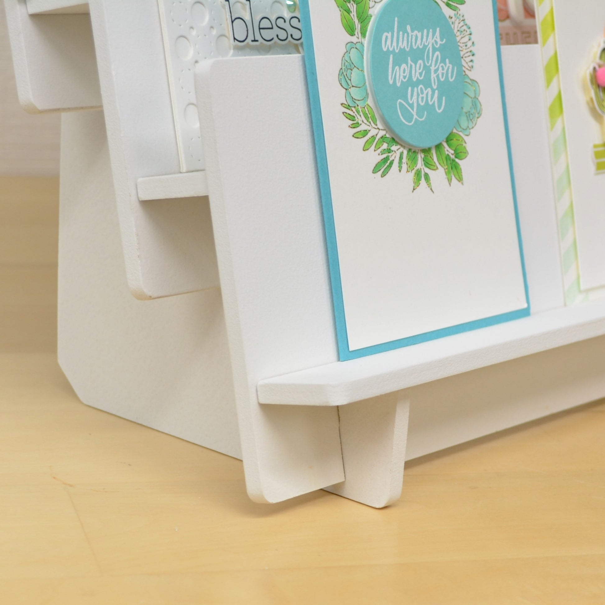 rounded edges of a white greeting card display stand