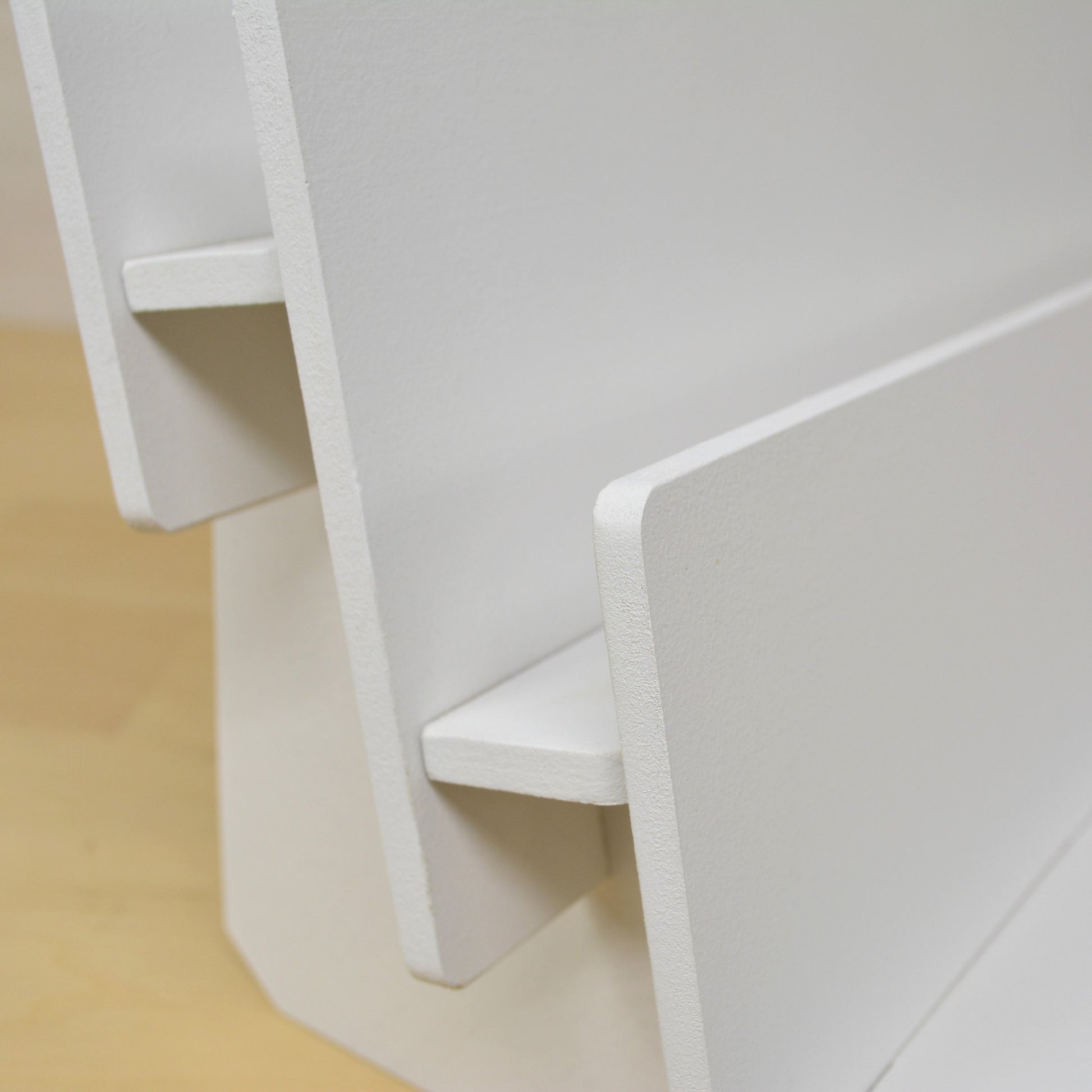 closeup view of the spacing between shelves on a handmade cards display stand