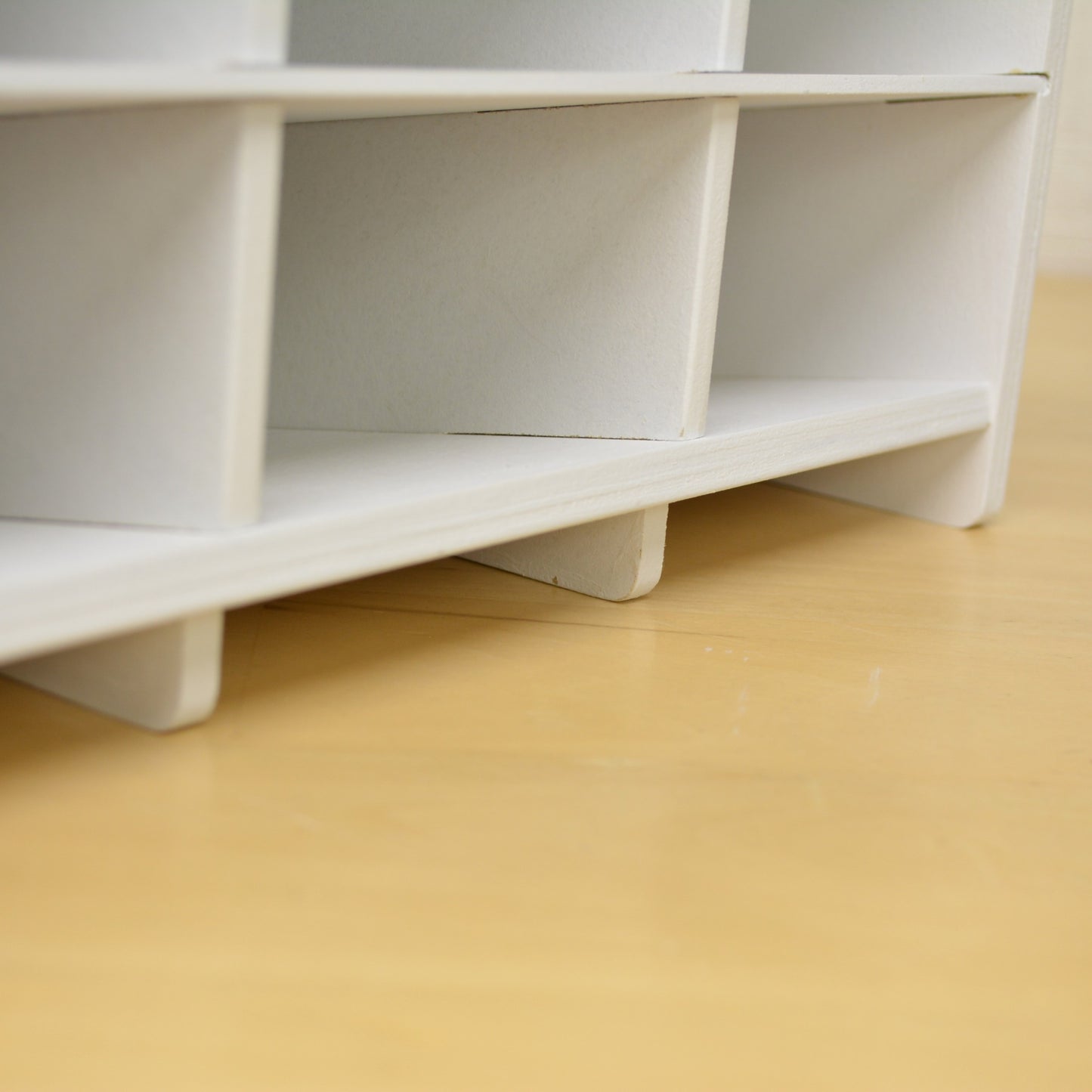 closeup of the bottom cubbies of a large marker organizer