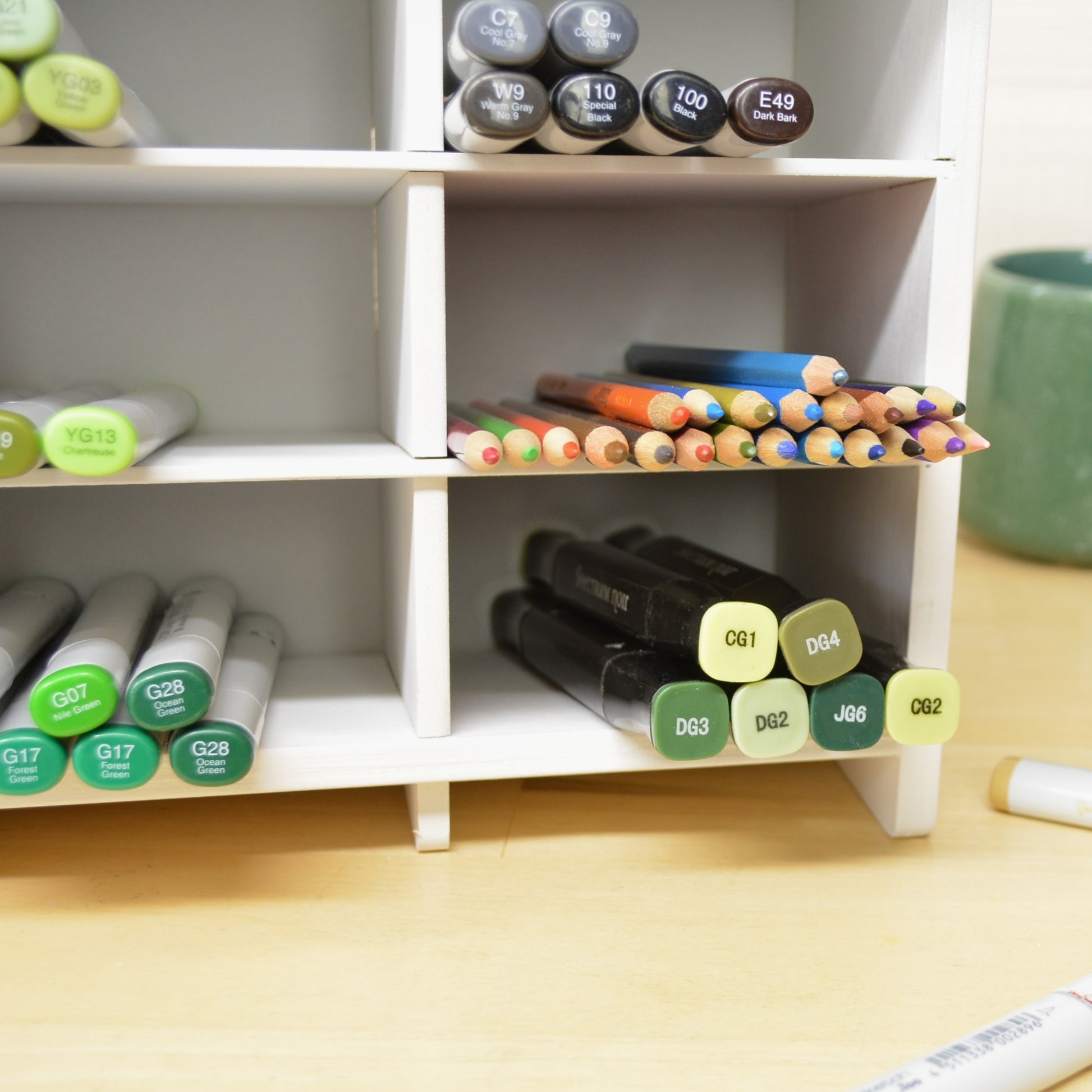 closeup of individual marker holder cubbies with spectrum noir markers