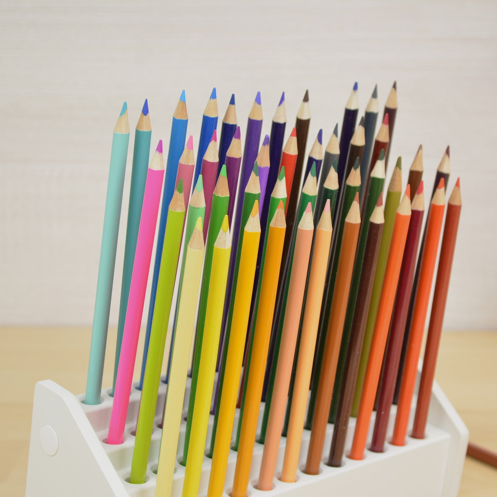 closeup view of colored drawing pencils in a desktop organizer