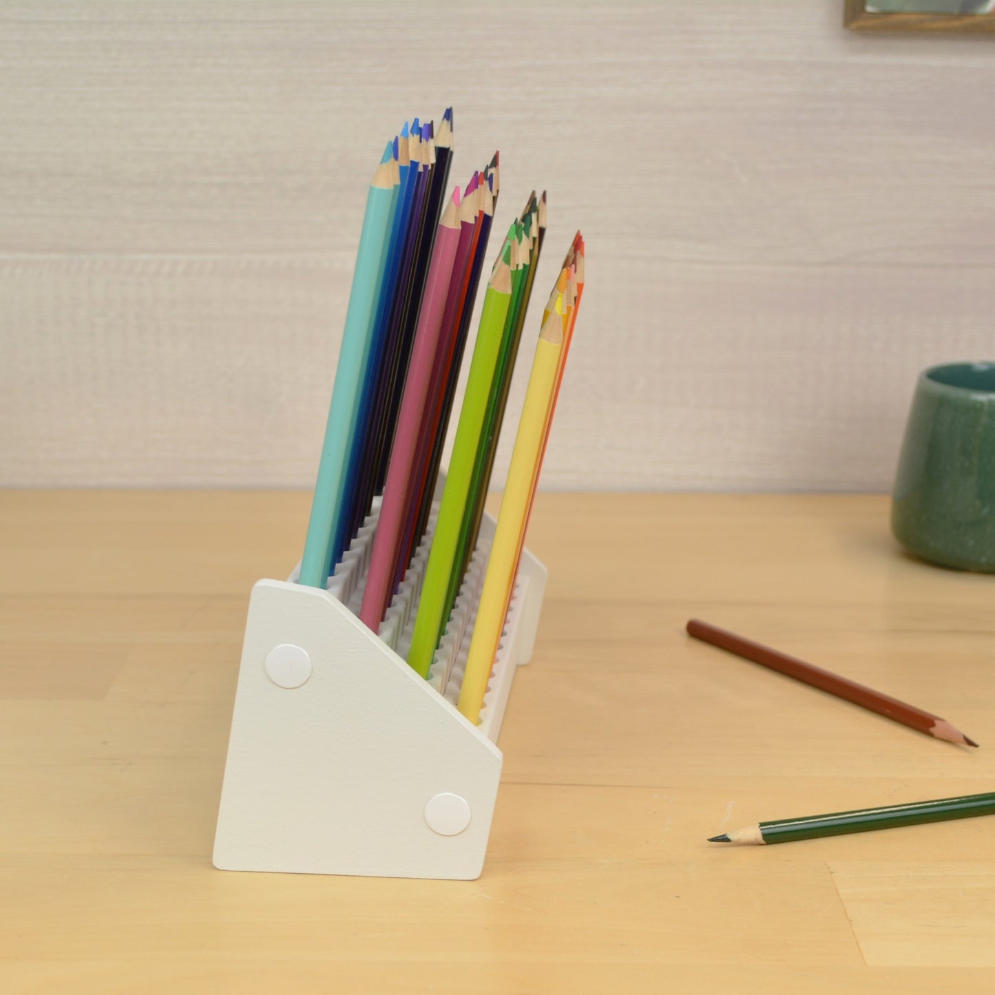 side view of a pencil holder showing the four tiered rows